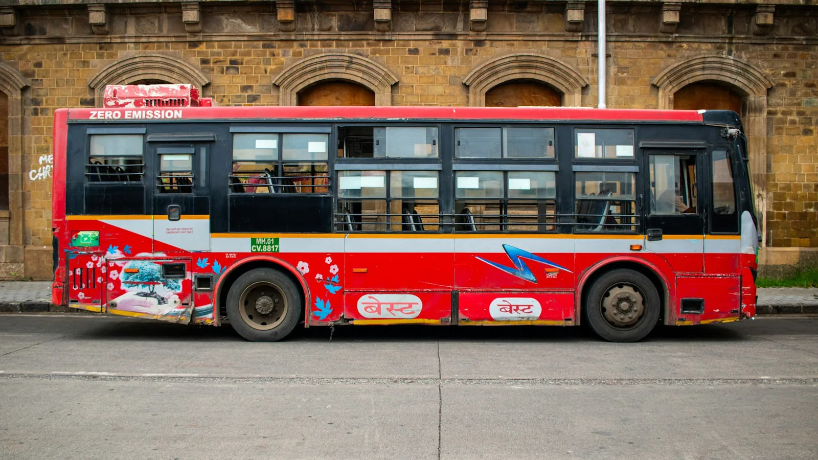 Red BEST city bus operating in Mumbai