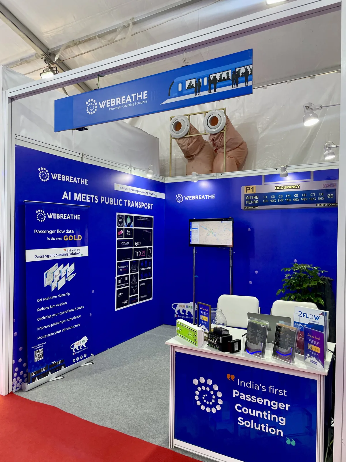 Angled view of the WEBREATHE booth at Urban Mobility India 2025